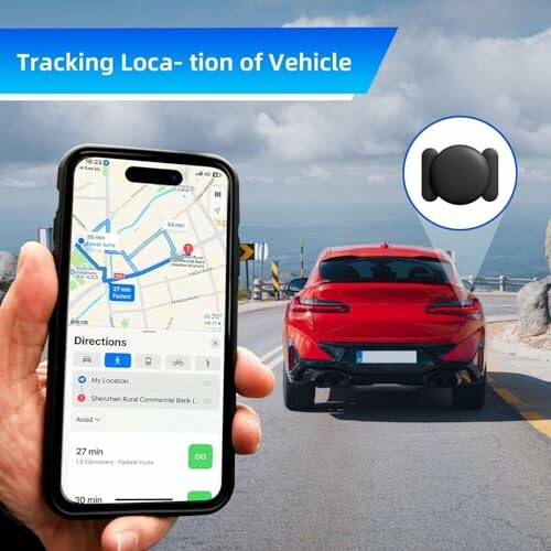Rotes Auto auf Straße mit Navigations-App auf Smartphone.